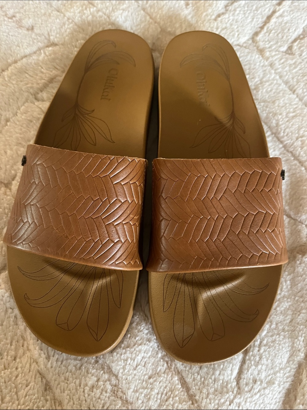 OluKai Braided Leather Slide Sandals in Tan